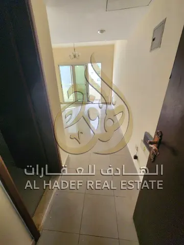Two-bedroom apartment with a balcony in Abu Shagara – spacious and naturally lit in a prime location
