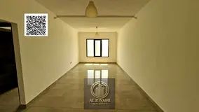 Two-bedroom apartment with a living room for rent in Al Rashidiya 1, balcony and amenities