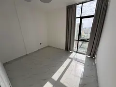 Two-bedroom apartment with a living room, brand new, for annual rent in Al Rawda, Ajman, next to Al