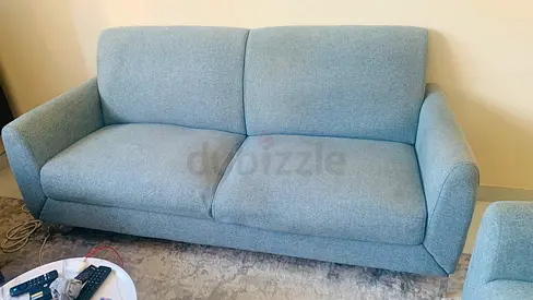 Light blue 2-seater fabric sofa - good condition