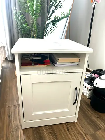White bedside nightstand with cabinet and door shelf