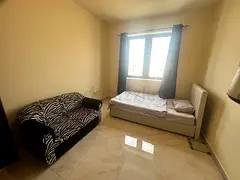 Spacious and private master bedroom available in a clean, quiet apartment. AED 2,700