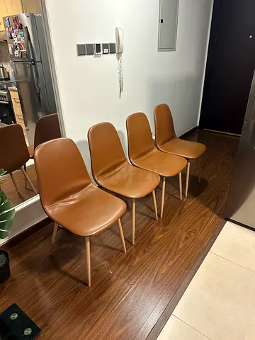 Set of 4 tan faux leather dining chairs with wooden legs