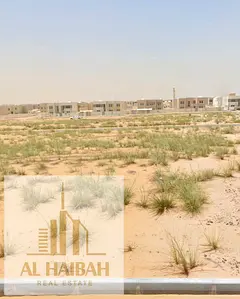 Two adjacent residential plots for sale in Rawdat Al Qurt, Sharjah.