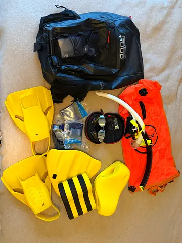 Swimming gear set — yellow fins, mask, snorkel, safety buoy  backpack