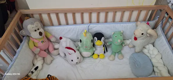 Gently used wooden baby crib with mattress and bumpers