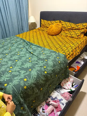 Gray bed with side table
