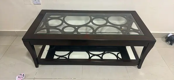 My glass-top wooden coffee table with lower shelf