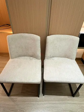 Pair of beige upholstered dining chairs (lightly used)
