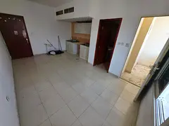 Studio apartment for annual rent with balcony, central air conditioning and cooling system in Rawda