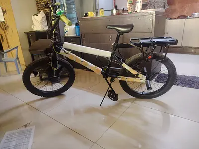 My black mountain-style bike with rear rack — used, good condition