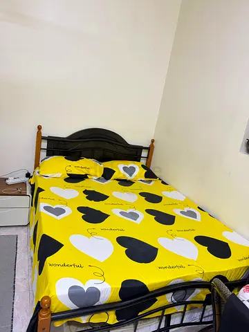 Comfortable Bed Frame with Fun Heart Pattern Bedding