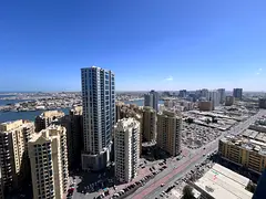 1BR hall for rent in Al Rashidiya 1 luxury towers Ajman equipped kitchen built in wardrobes gym pool