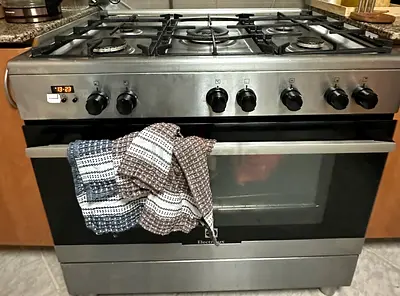 Stainless-steel gas range with built-in oven - used, working