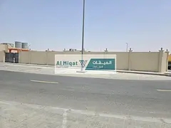 Land for sale with a wall in Al Sajaa