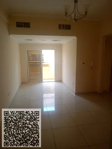Two-bedroom apartment with a living room for annual rent in Al Nuaimiya 1, opposite Al Hikma School, with free swimming pool and gym access.