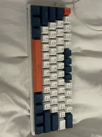 My compact 65% mechanical keyboard — white/navy keycaps with orange spacebar gaming keyboard