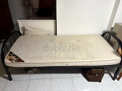 Single metal bed frame with mattress — used (stains, functional)