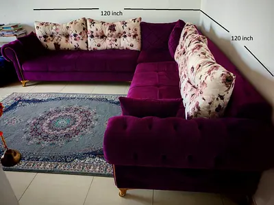 My purple L-shaped velvet sectional sofa - 120 inch x 120 inch with floral cushions - 7 Seater