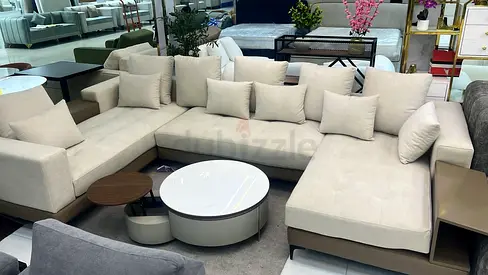 My beige L-shaped sectional sofa with chaise  built-in side table
