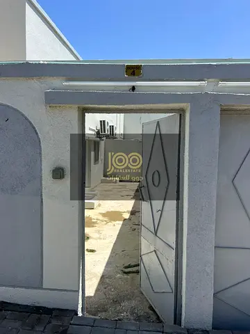 Arabic-style house for rent in Umm Al Quwain, Isa area, with 2 bedrooms and a spacious living room. Ready for immediate occupancy, annual rent AED 35,