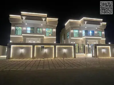 Villa for sale in Ajman, Al Helio 2 area. The villa features 4 master bedrooms, a majlis (formal sitting room), 2 living rooms, a fully equipped kitch