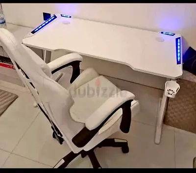 White computer/gaming desk with LED lights and cup holder