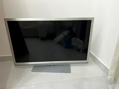Silver flat-screen LCD TV - working condition