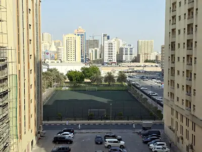 Best-priced 1BR apartment with central AC, balcony, spacious layout, family building, near King Abdulaziz St, Al Qasimia Al Mahatta.