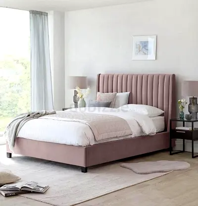 Dusty pink upholstered King Size bed frame with channel headboard