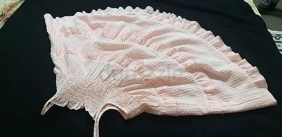 Light pink smocked sundress with ruffle hem - good condition