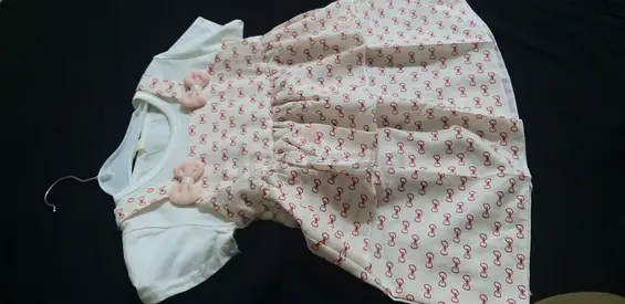 Baby girls pink cotton dress with bow details -