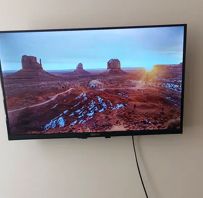 Wall-mounted LED TV - Good working condition