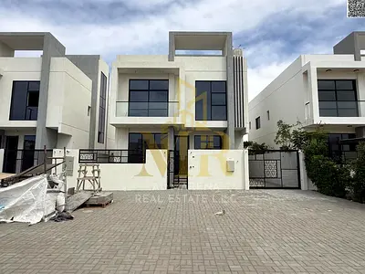 Villa for sale in Al Helio – Ajman, two floors and a roof | 5 master bedrooms | Central air conditioning | Includes electricity, water and AC units, f