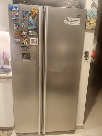 LG refrigerator side by side doors, 708 Litres