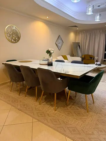 My marble-top 8-seater dining set with velvet chairs