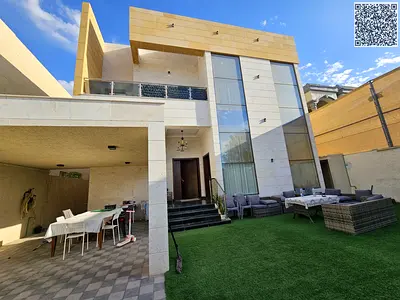Villa for sale in Al Muwaihat 3 - Modern design and central air conditioning - Land area 5000 sq ft