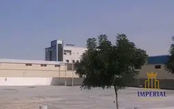 fenced industrial land without electricity) for rent in Umm Al-Thuoub