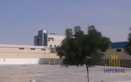 fenced industrial land without electricity) for rent in Umm Al-Thuoub