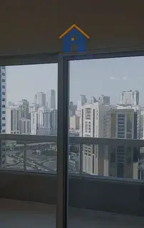 Two bedrooms with balcony and parking space for sale in Al Nahda, with an open view