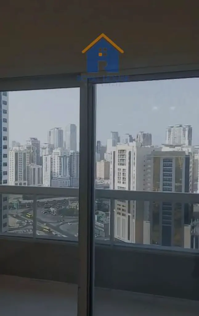 Two bedrooms with balcony and parking space for sale in Al Nahda, with an open view
