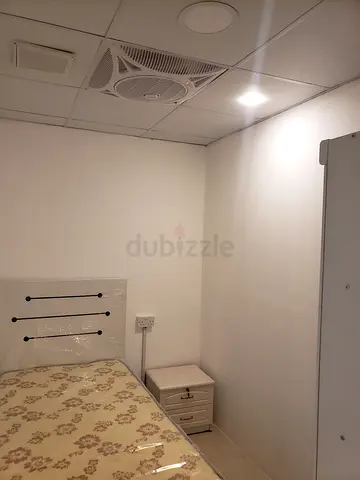 Room with partition rent For Executive bechlor near DAFZA Metro station QUSAIS1