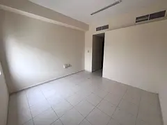 Studio for annual rent in Al Rashidiya - Ajman, separate kitchen, prime location close to all servic