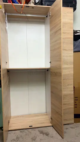 2-door freestanding wardrobe / armoire – oak finish (used)