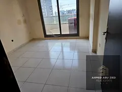 2-bedroom apartment for rent in Emirates City Ajman with 2 bathrooms, balcony, and free parking, ide