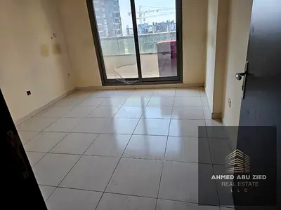 2-bedroom apartment for rent in Emirates City Ajman with 2 bathrooms, balcony, and free parking, ideal for families in a good location, 34,000 AED yea