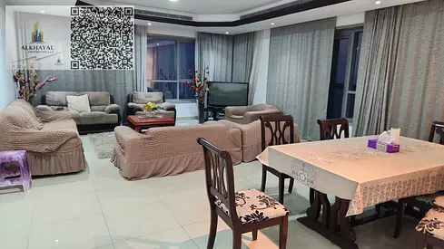 For annual rent in Ajman, Corniche Towers, partial view, two-bedroom apartment with a living room, master bedrooms, spacious