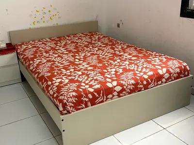 Beige platform double bed with included mattress - good condition