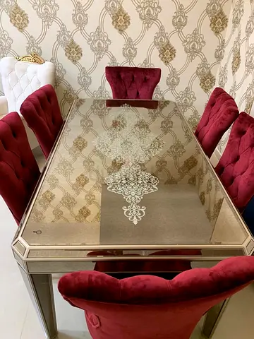 Elegant Glass-Top Dining Table with 6 Burgundy Velvet Chairs