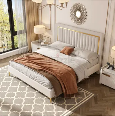 Modern King Size upholstered bed with gold trim